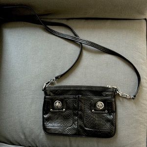 Flat crossbody with silver grommets and hardware